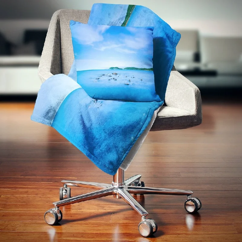 Cotton blankets for breathability and a lightweight feelDesignart 'Baratti Bay Small Rocks in Blue Sea' Seashore Throw Blanket