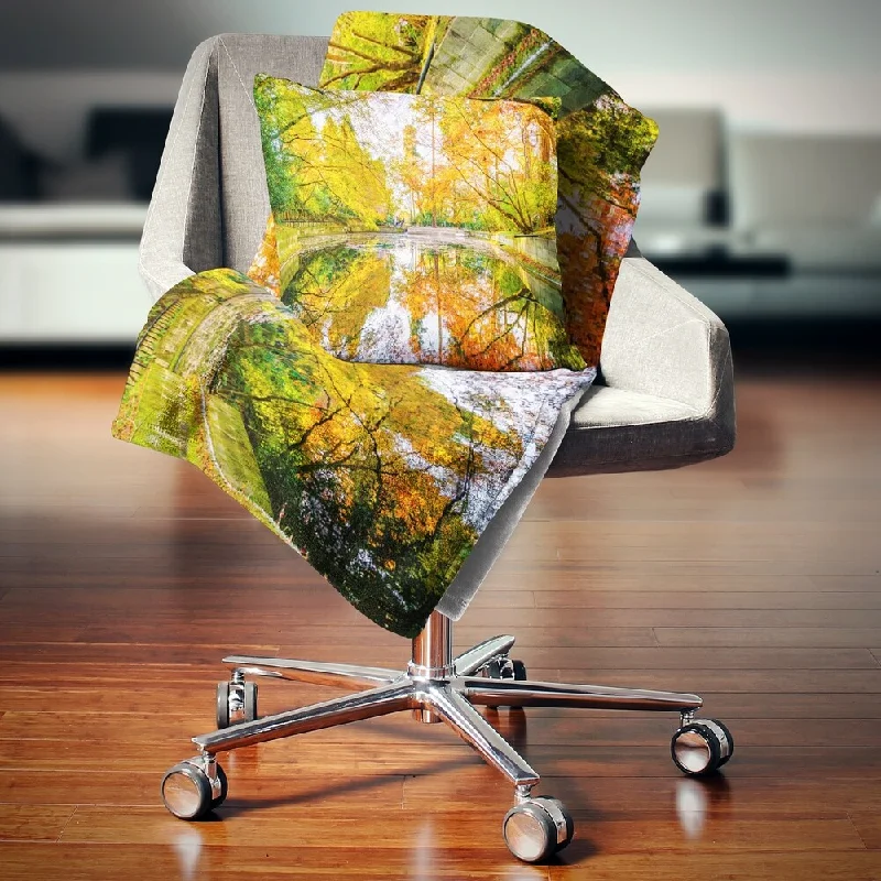 Cotton blankets for breathability and a lightweight feelDesignart 'Bright Fall Forest with River' Landscape Fleece Throw Blanket