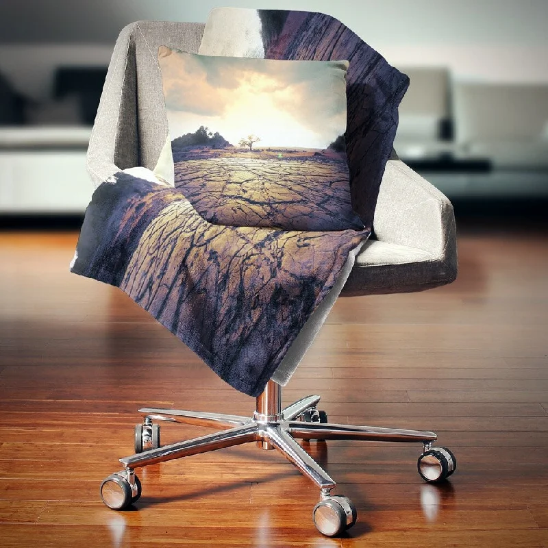 Alpaca wool blankets for a hypoallergenic and warm optionDesignart 'Cracked Drought Land with Sunshine' Landscape Fleece Throw Blanket