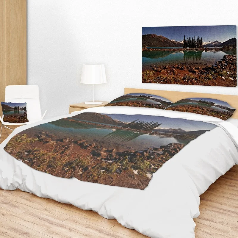Cotton blankets for breathability and a lightweight feelDesignart 'Lake and Pine Trees in Evening' Landscape Fleece Throw Blanket