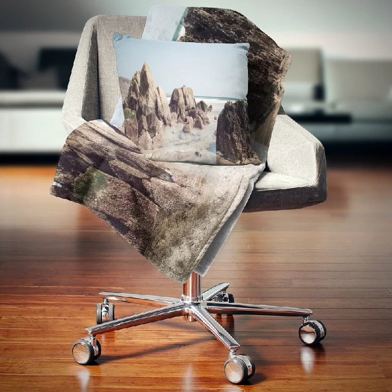 Cashmere blankets for ultimate softness and luxuryDesignart 'Large Rocks at Coast Panorama' Seashore Throw Blanket