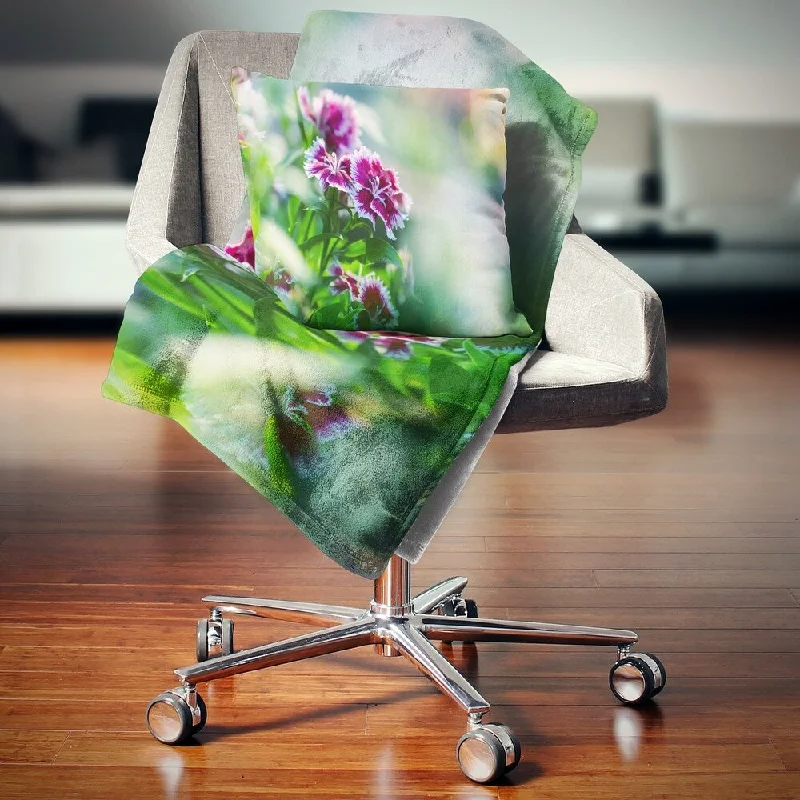 Microfiber blankets that are durable and easy to care forDesignart 'Pink Flowers on Green Background' Floral Throw Blanket